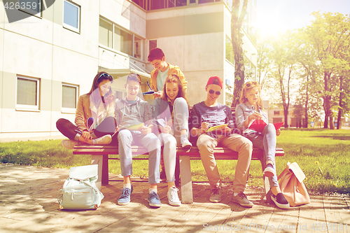 Image of group of students with notebooks at school yard