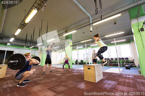 Image of group of people exercising in gym