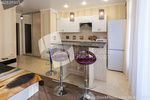 Image of Interior studio apartments, view of the kitchen and the bar