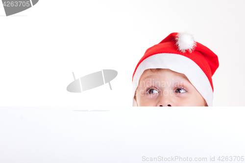 Image of Happy little smiling boy with christmas hat.