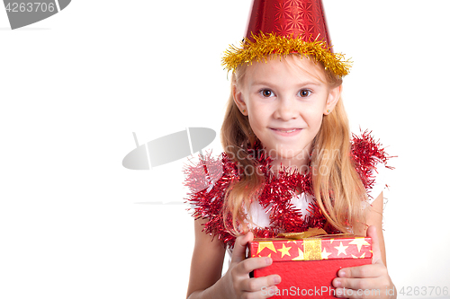 Image of Happy little smiling girl with christmas gift box.