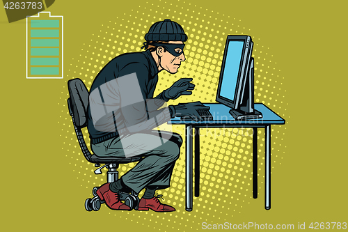 Image of Caucasian hacker thief hacking into a computer