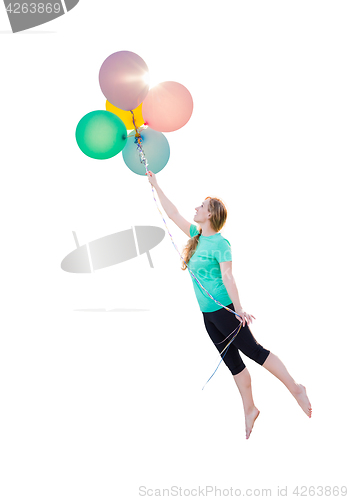 Image of Young Girl Being Carried Up and Away By Balloons That She Is Hol