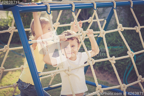 Image of happy children playing on the playground