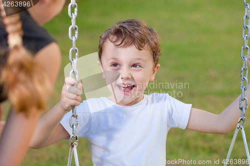 Image of happy children playing on the playground