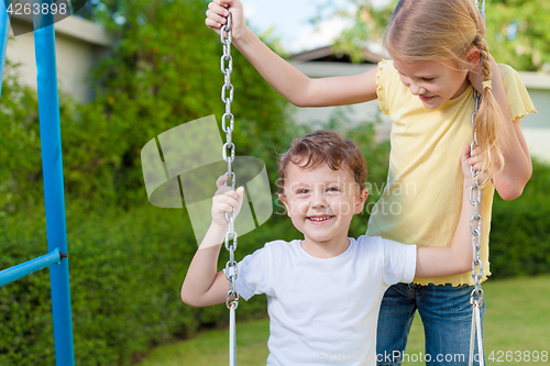 Image of happy children playing on the playground