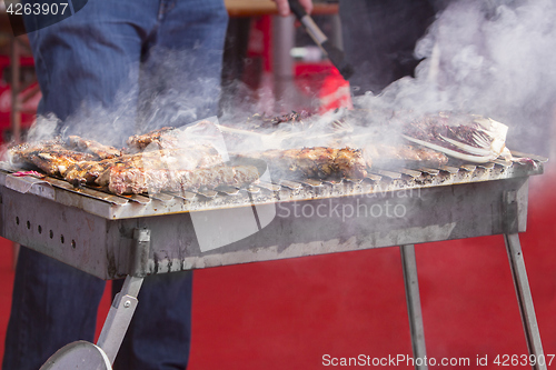 Image of Chef bbq grilled pork ribs on smoke