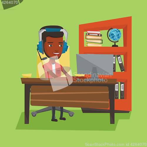 Image of Business man with headset working at office.