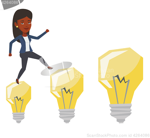 Image of Business woman jumping on idea bulbs.