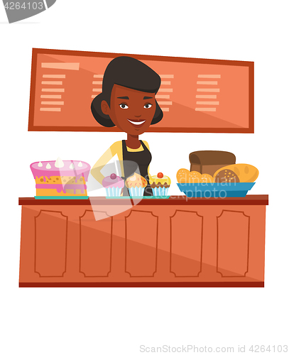 Image of Worker standing behind the counter at the bakery.