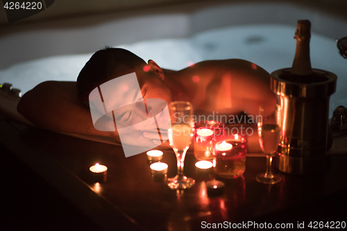 Image of man relaxing in the jacuzzi