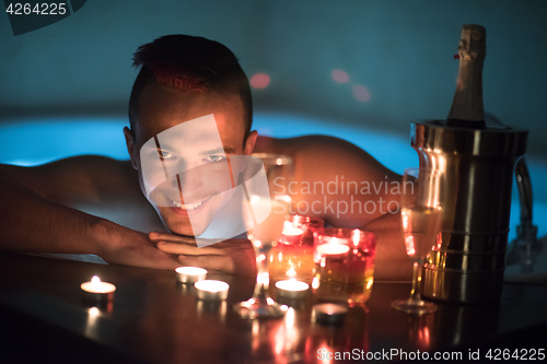 Image of man relaxing in the jacuzzi