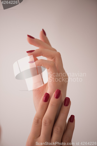 Image of closeup of hands of a young woman