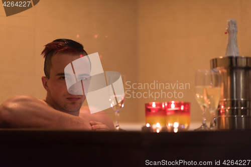 Image of man relaxing in the jacuzzi