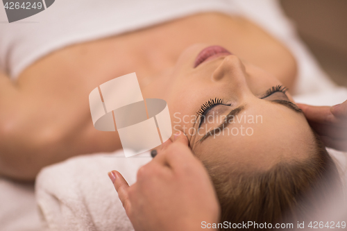 Image of woman receiving a head massage