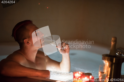 Image of man relaxing in the jacuzzi