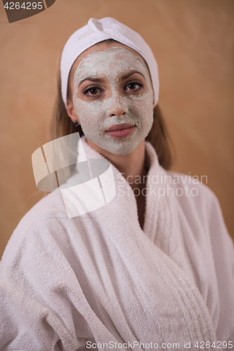 Image of Spa Woman applying Facial Mask