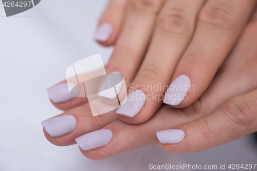 Image of woman fingers with french manicure