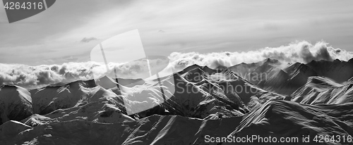 Image of Black and white panorama of evening snow mountains at winter