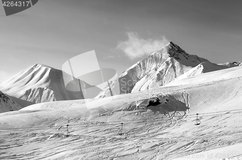 Image of Black and white view on ski slope at winter evening