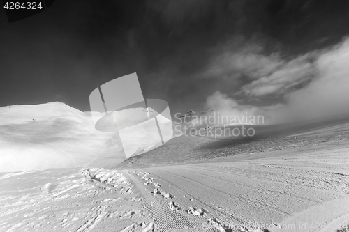 Image of Black and white view on ski slope with footprints