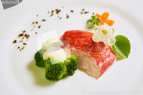 Image of The red snapper with vegetable. Shallow dof.