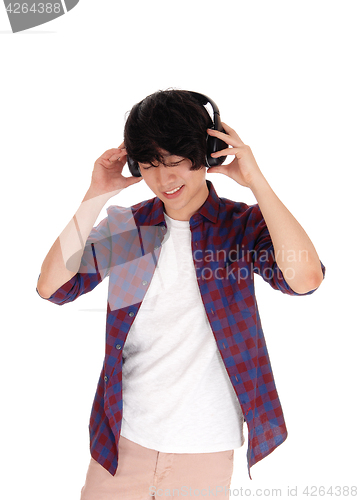 Image of Asian man listen to music.