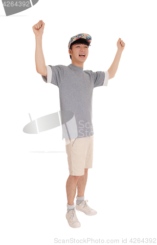 Image of Happy Asian man with arms raised.