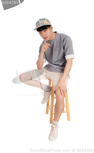 Image of Asian man sitting and thinking.