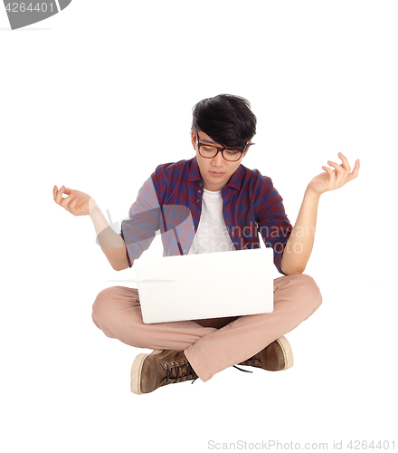 Image of Young Asian teen with laptop.