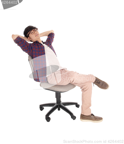 Image of Asian teenager relaxing on chair.
