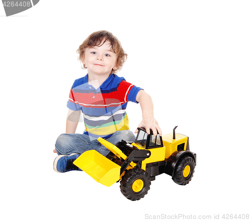 Image of Three year old boy with his toy.