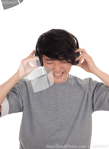 Image of Asian man listen to music.