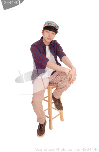 Image of Asian man sitting and relaxing.