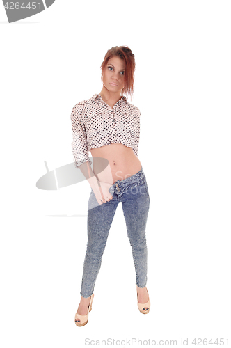Image of Serious woman standing from the front.