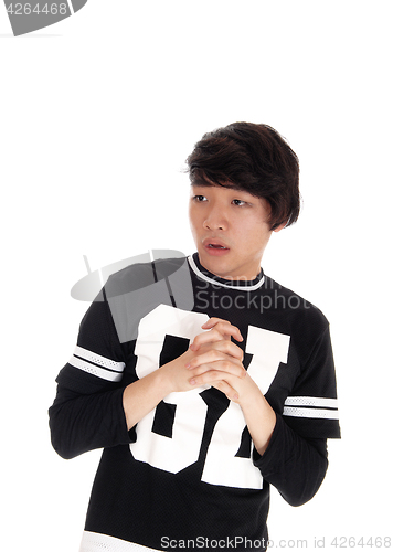Image of Young Asian man scared looking.
