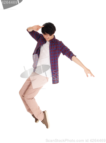 Image of Asian man dancing on his toes.