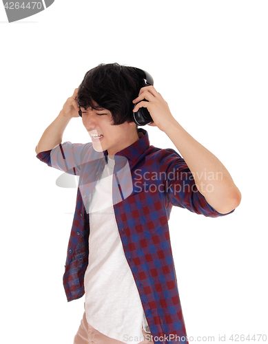 Image of Asian man listen to music.