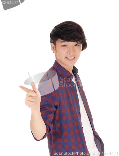 Image of Asian teenager pointing finger.