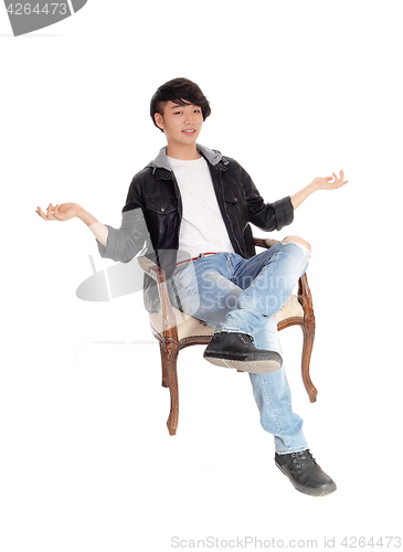 Image of Asian teenager sitting and don't know.