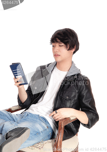 Image of Asian man talking on his cellphone.