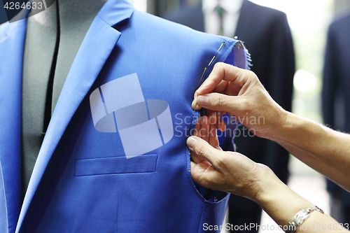 Image of Men&#39;s tailoring, sewing jackets.