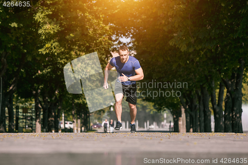 Image of Man running in park at morning. Healthy lifestyle concept