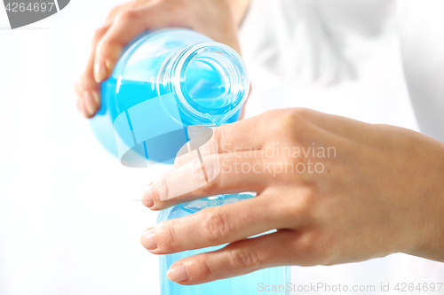 Image of Chemist poured liquids in glass rulers