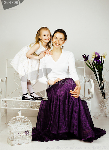 Image of young mother with daughter at luxury home interior vintage