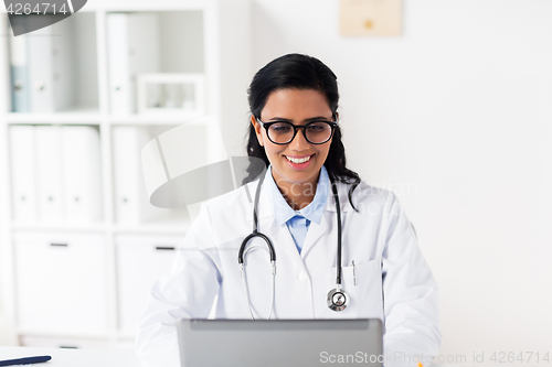 Image of female doctor with laptop at hospital