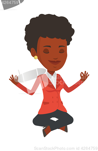Image of Peaceful businesswoman meditating in lotus pose.