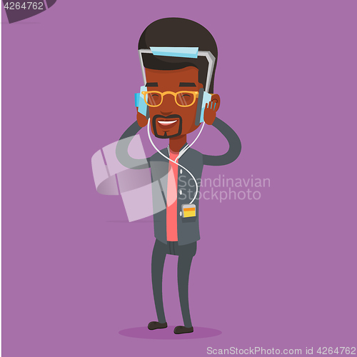 Image of Young man in headphones listening to music.