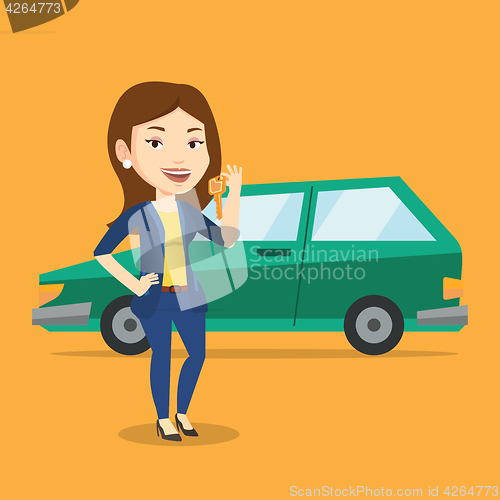 Image of Woman holding keys to her new car.