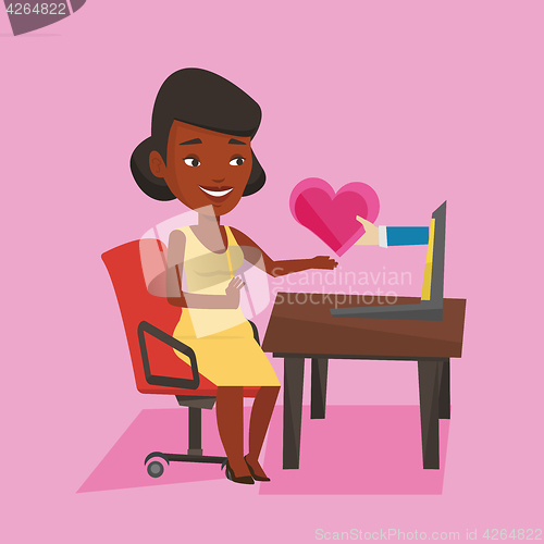 Image of Young woman dating online using laptop.